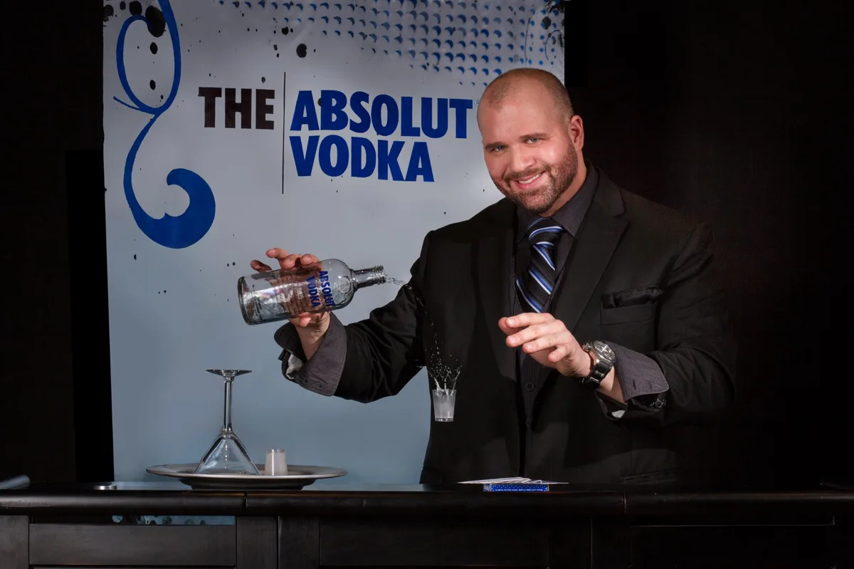 Mike DiDomenico performing magic at Absolut Vodka corporate event
