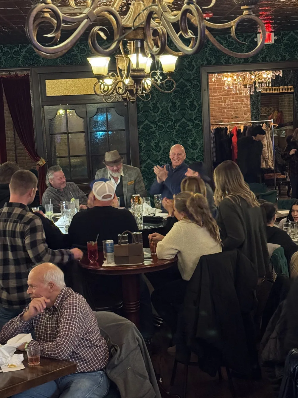 Mike DiDomenico performing intimate close-up card magic at a tableside setting