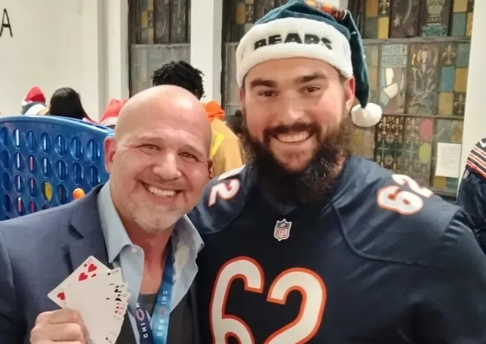 Mike DiDomenico with Chicago Bears center Lucas Patrick at Bears Care holiday event