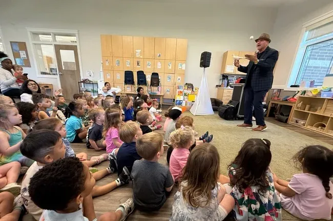 Mike DiDomenico performing for preschool classroom of children